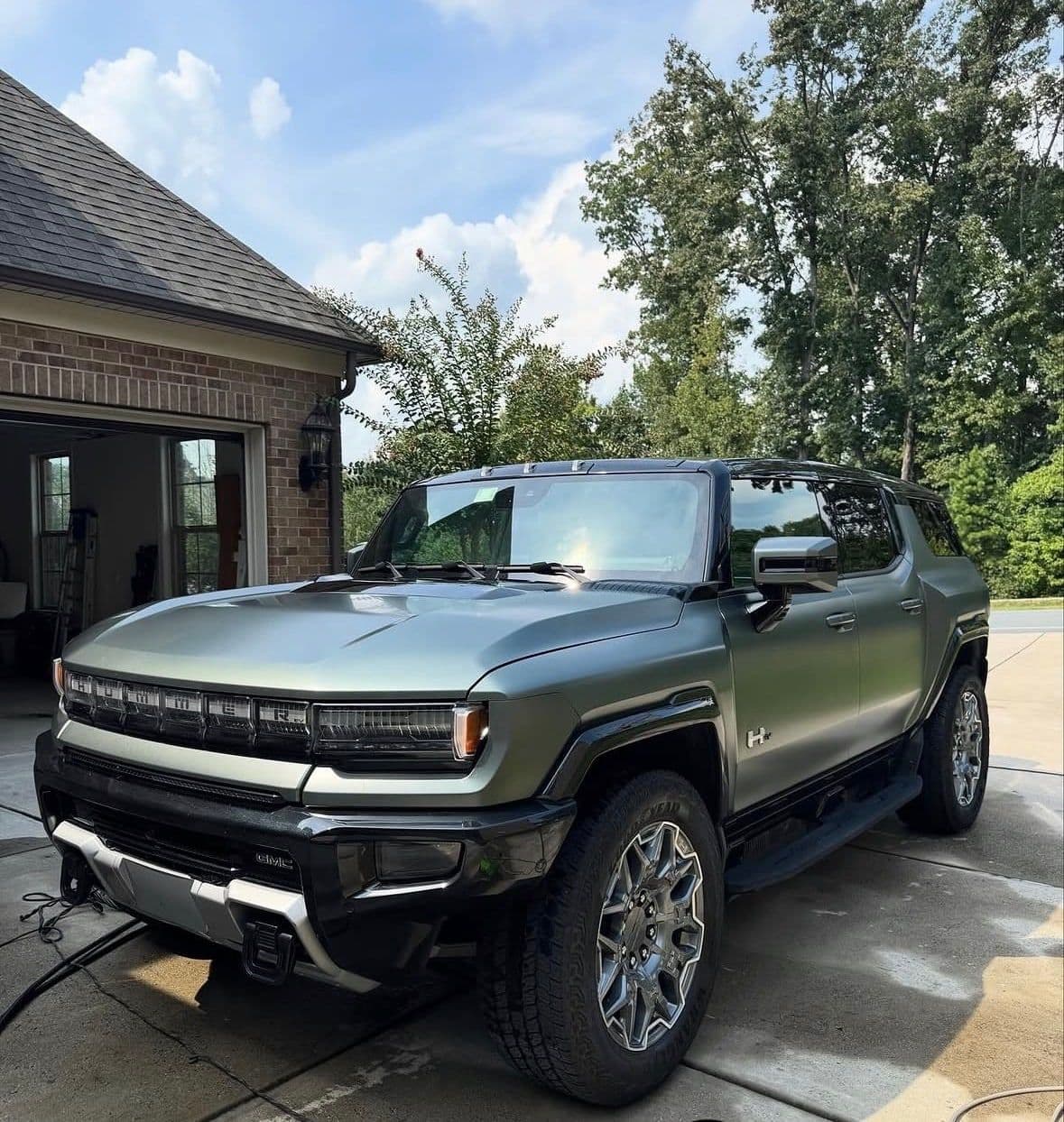 The same GMC Hummer EV with a clean, even finish after an exterior detail.